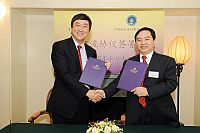 Prof. Joseph Sung (left) and Prof. Chen Shanguang (right) at the signing ceremony.